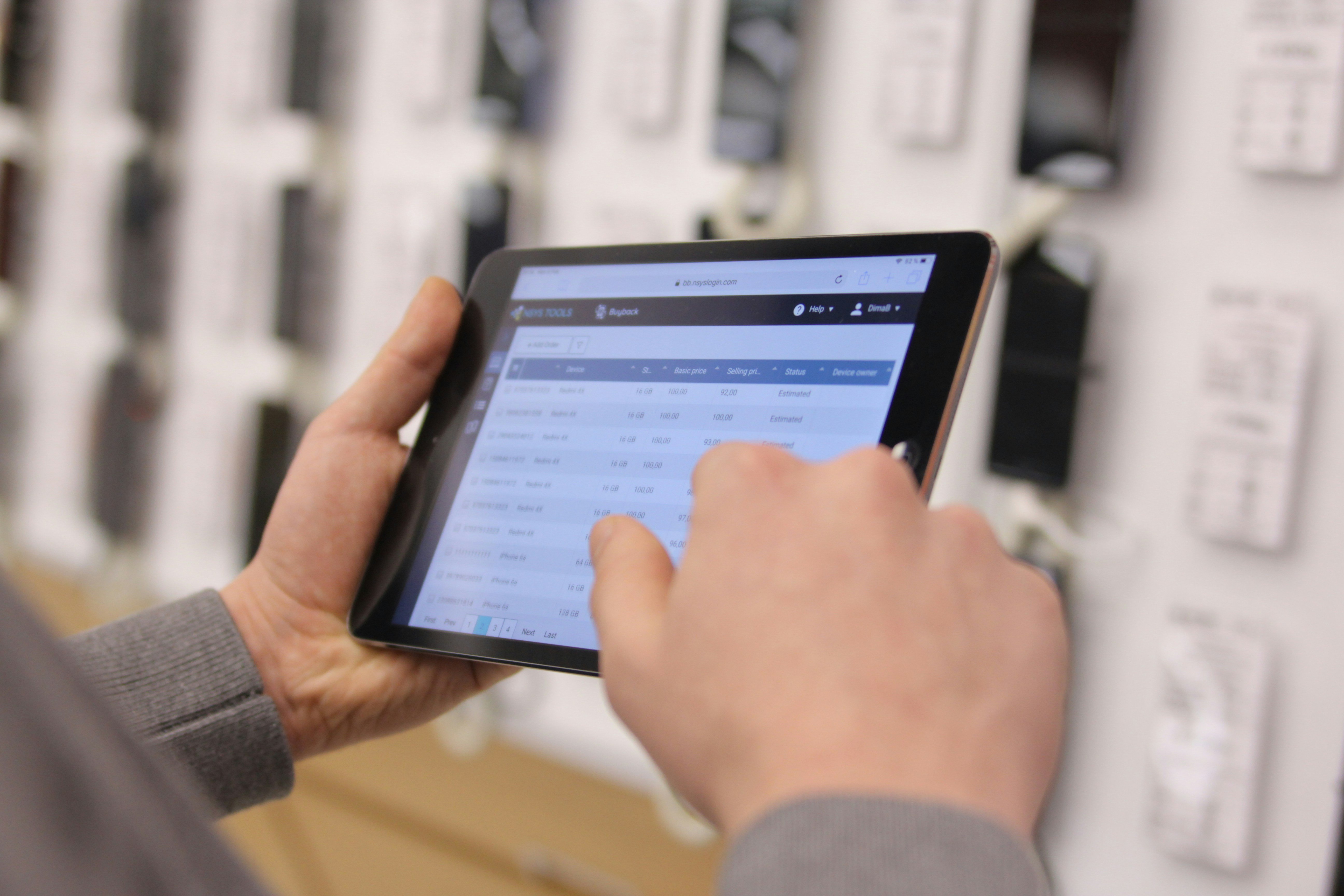 Operations manager using tablet to monitor logistics performance